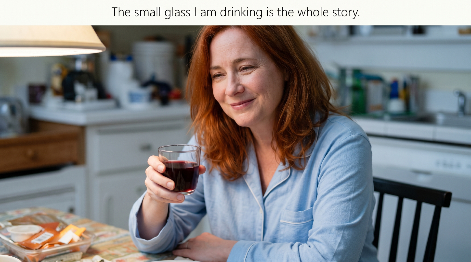 Maggie at her kitchen table holding a small glass of tart cherry juice